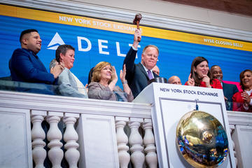 Gil West rings closing bell at New York Stock Exchange