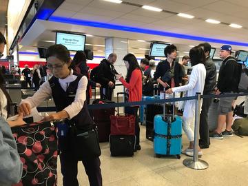 Employees help customers in Seattle