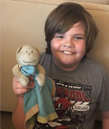 Boy with monkey doll