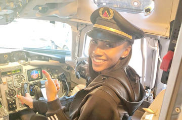 Maria Taylor tour cockpit in Delta captain's hat