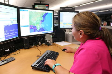 Delta meteorologist studying computer