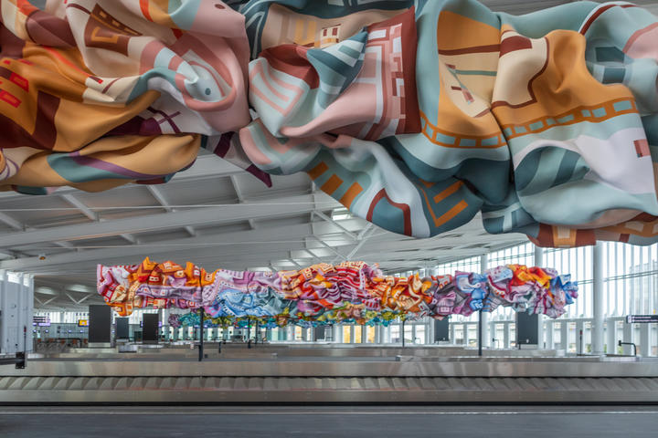 Baggage claim at International Arrivals Facility, featuring work by local Seattle artist Marela Zacarias