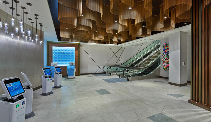 Once checked in, guests will ascend the monumental staircase or escalators, passing beneath dazzling ceiling fixtures modeled after ocean waves before arriving at the custom wood-screened area that marks the Club’s entrance. 