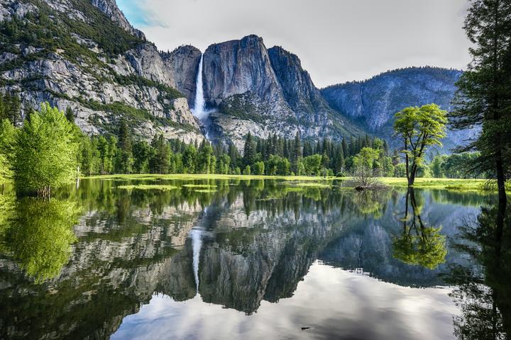 Mountains reflected in the water at Yosemite Valley in Yosemite National Park, California 