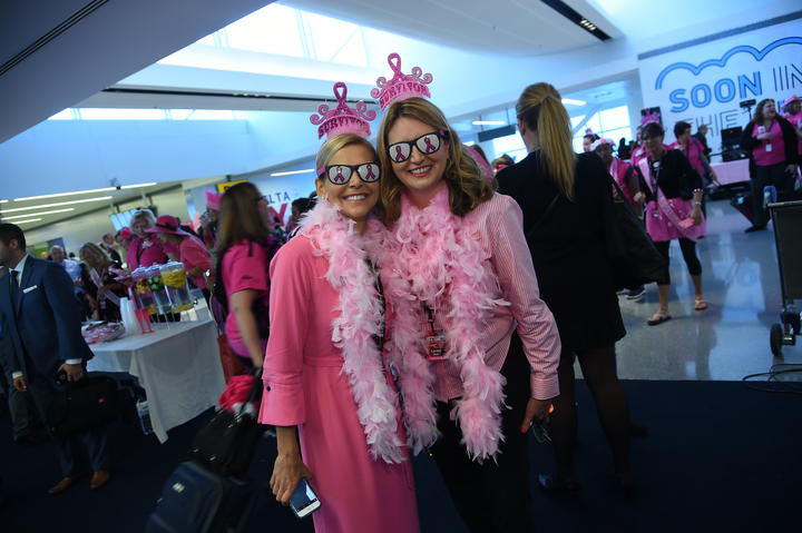 Employee survivors celebrating on \