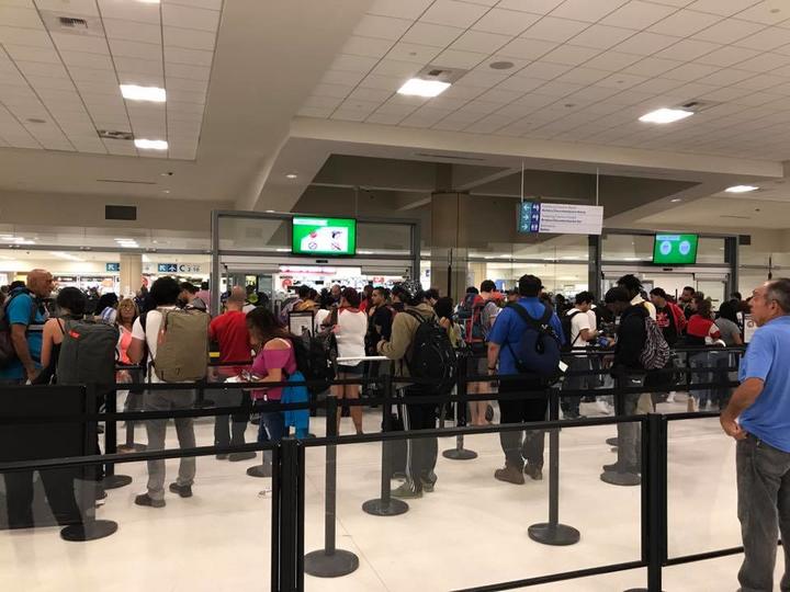 Customers in line at San Juan airport before Maria