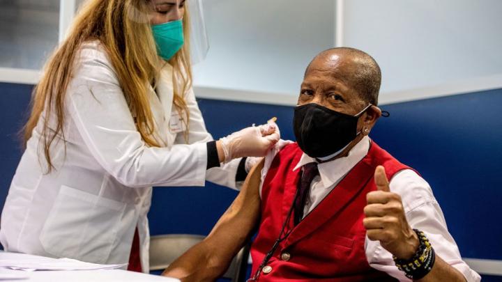 A Delta employee receives the COVID-19 vaccine.