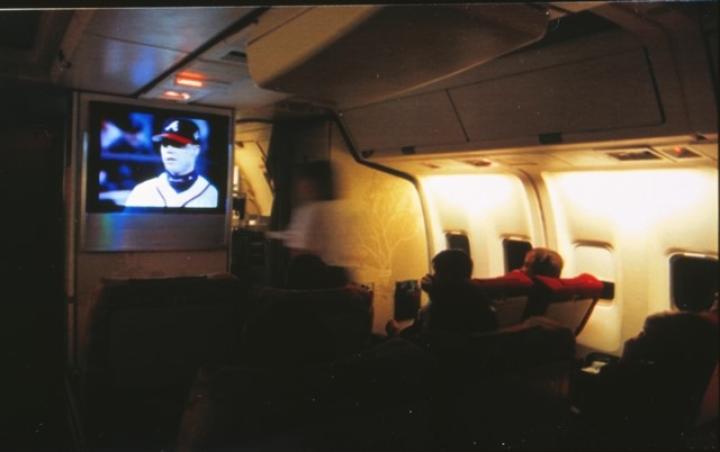Passengers onboard Spirit of Delta watch a 1996 baseball postseason game featuring the Atlanta Braves live.