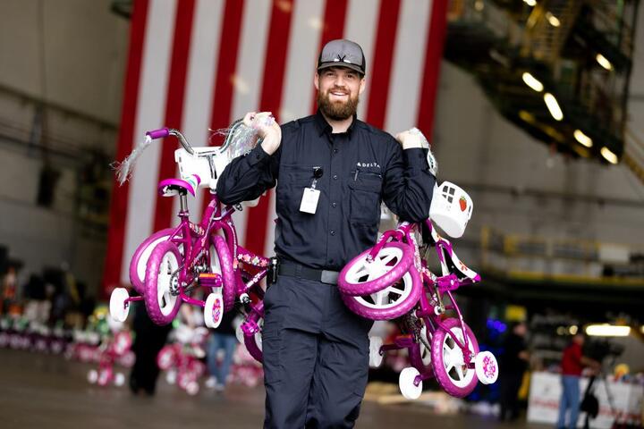 Delta people from TechOps, In-Flight Service, Global Sales, Finance, IT and Flight Operations rallied to purchase and assemble bicycles, as well as rally toy and money donations to support Toys for Tots.