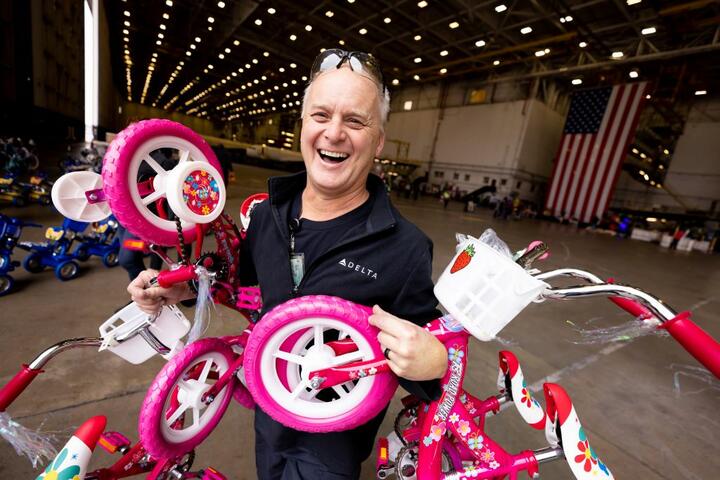 Delta people from TechOps, In-Flight Service, Global Sales, Finance, IT and Flight Operations rallied to purchase and assemble bicycles, as well as rally toy and money donations to support Toys for Tots.