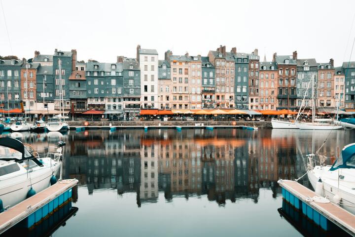 Colorful half-timbered houses line the picturesque harbor in Honfleur.