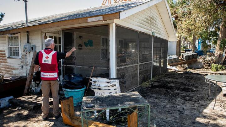 An American Red Cross volunteer aids the needs of others in the wake of Hurricane Helene.