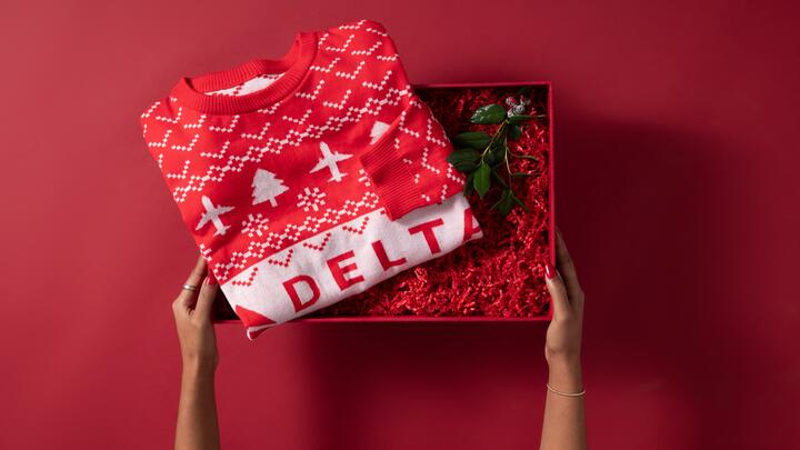 Show off your love for travel this winter with our Red Delta Holiday Sweater. Cozy and colorful, this sweater is perfect for any festive occasion. 