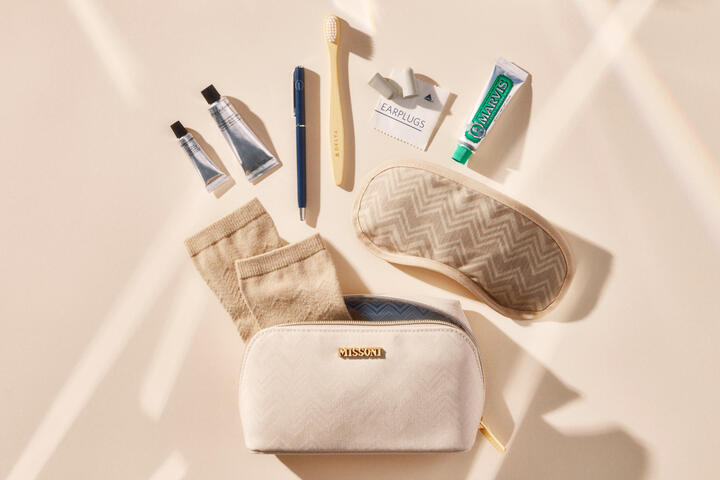 A shot featuring the new Delta One x Missoni amenity kit and the products featured inside the kit, which includes Missoni socks, Grown Alchemist skincare and more.