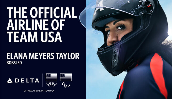Promotional graphic with text reading ‘The Official Airline of Team USA’ and ‘Elana Meyers Taylor – Bobsled,’ alongside Delta, Olympic, and Paralympic logos. Bobsled athlete in a helmet and suit on right side of the image