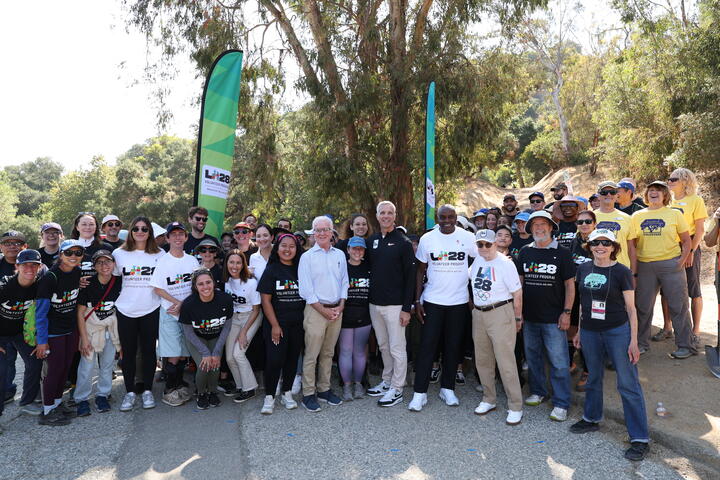 A group of Delta Air Lines volunteers pose for a picture in a Los Angeles park after finishing a community event.