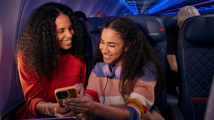 Delta customers enjoy entertainment on their phone while taking advantage of Delta's fast, free Wi-Fi.