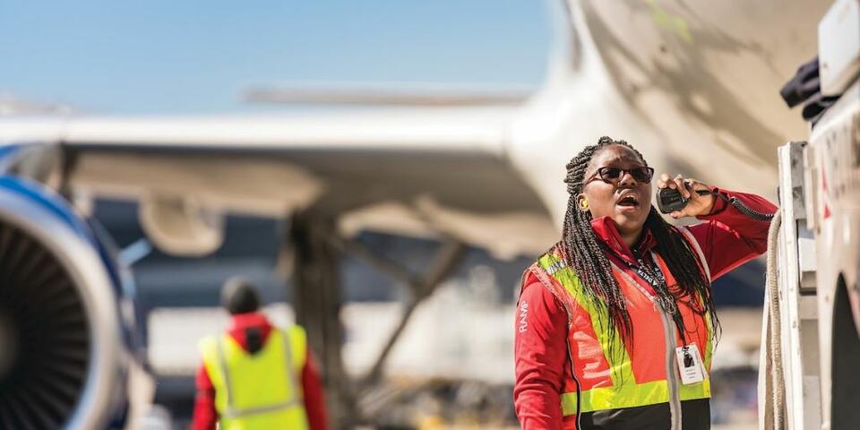 A Delta employee working on the ramps.