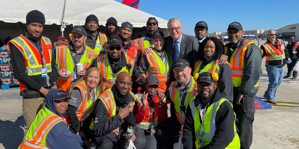 Delta CEO Ed Bastian poses with ramp crew members in Atlanta for Employee Appreciation Day.