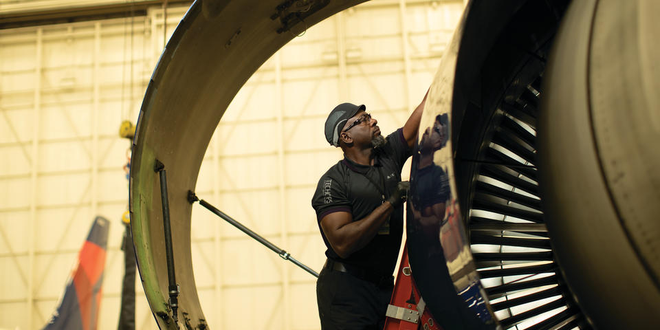 Cedric M. from Delta's TechOps team works on a Delta aircraft.