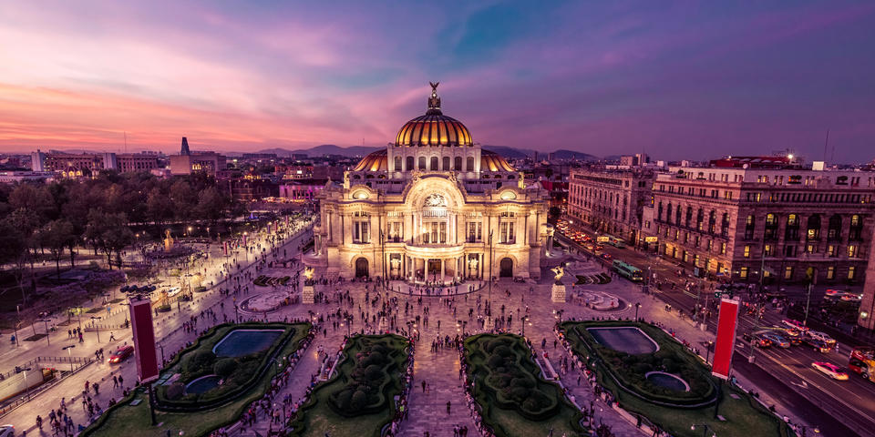 The Palacio de Bellas Artes in Mexico City gleams at twilight.