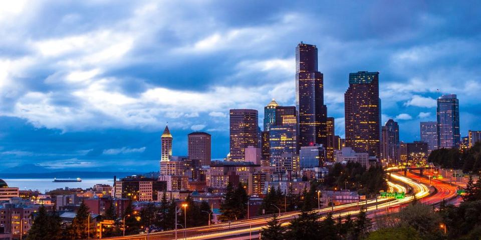 An image of downtown Seattle, lit up at night.