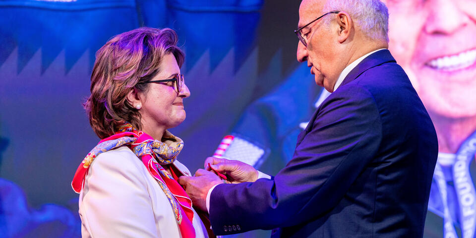 Ambassador of France Philippe Étienne presents French Legion of Honor to Virginie Durr.