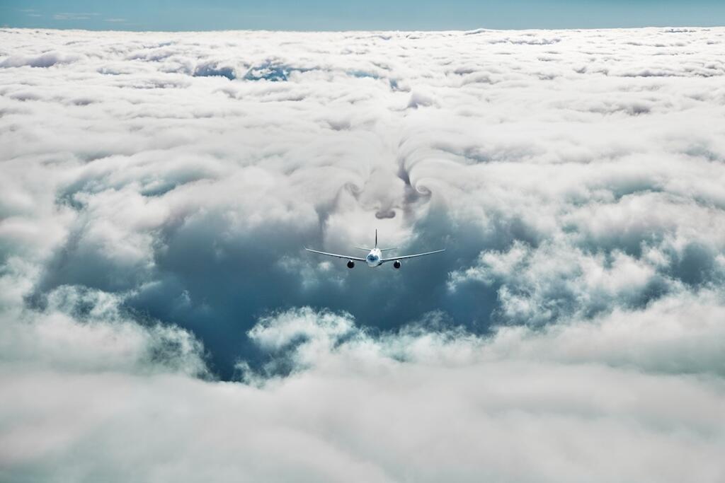 image of N8 Plane flying in clouds