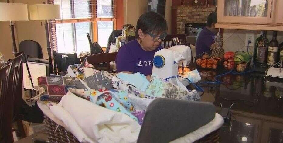 Delta employee sewing face masks