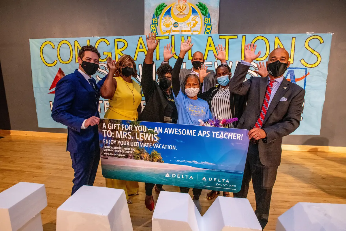 Delta surprises special education teacher with the gift of a summer vacation