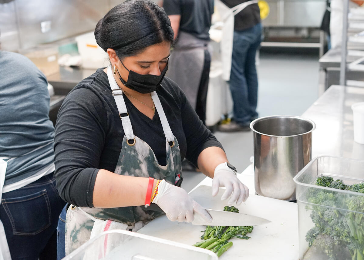 Jon + Vinny’s culinary team prepares food for Delta flights