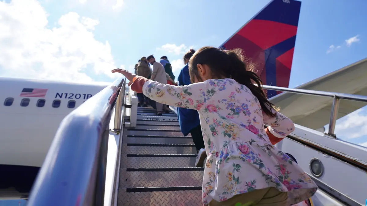Evacuees from Afghanistan board at Ramstein air base.