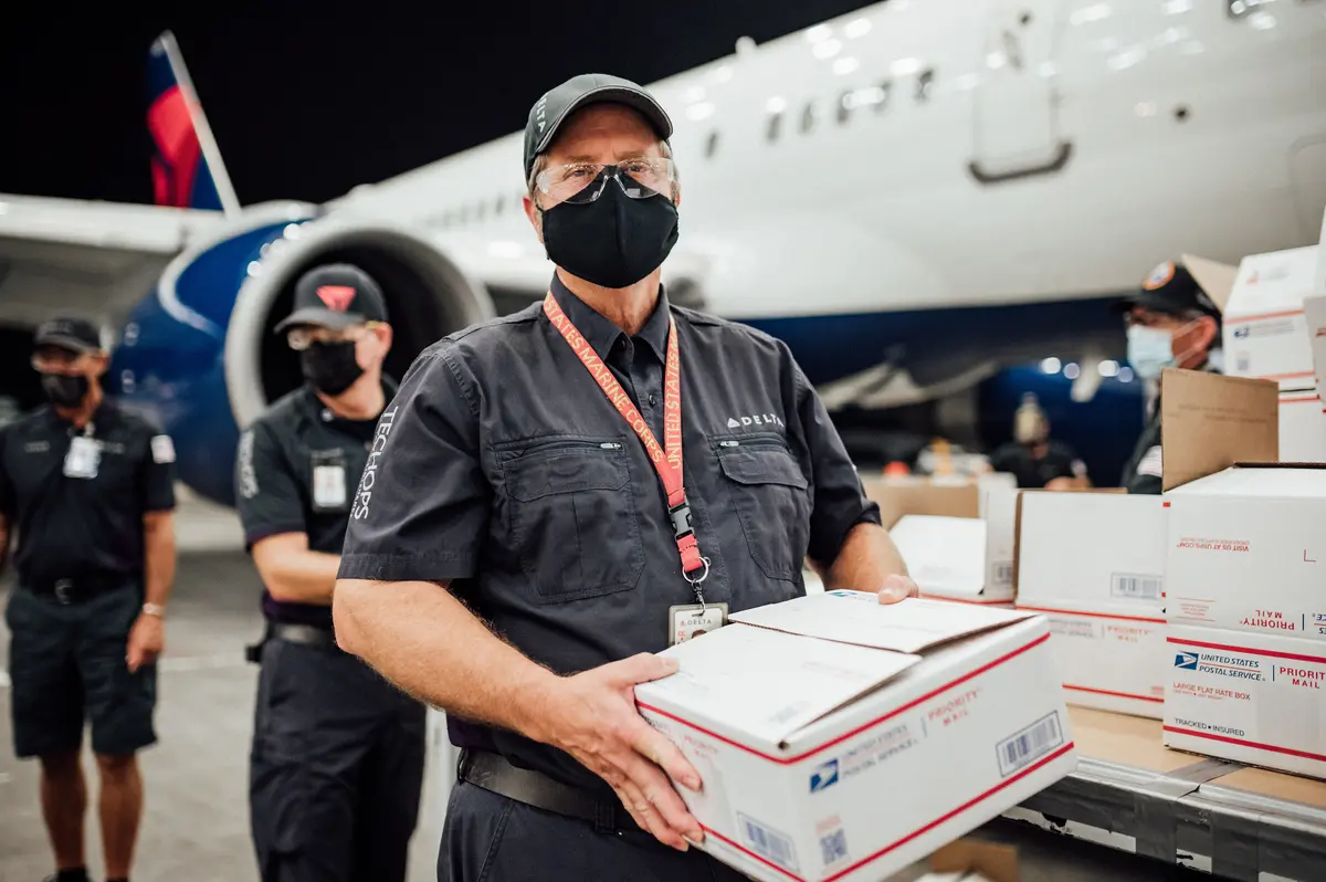 TechOps employee and veteran ships out 7,000th care package to military 