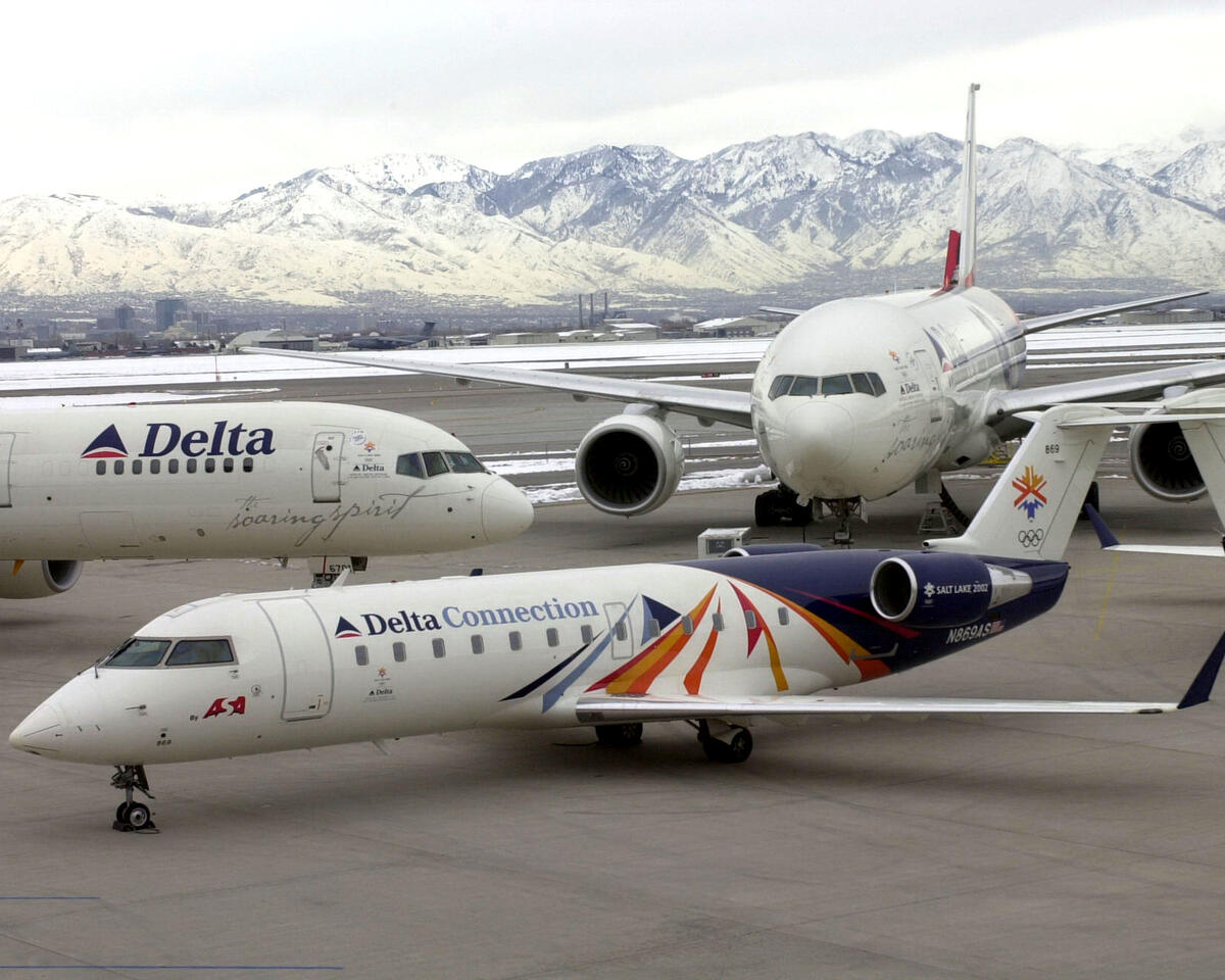 A Delta Connection aircraft adorned in a custom livery commemorating the 2002 Olympic Winter Games alongside Soaring Spirit I and Soaring Spirit II. (Courtesy Delta Museum)