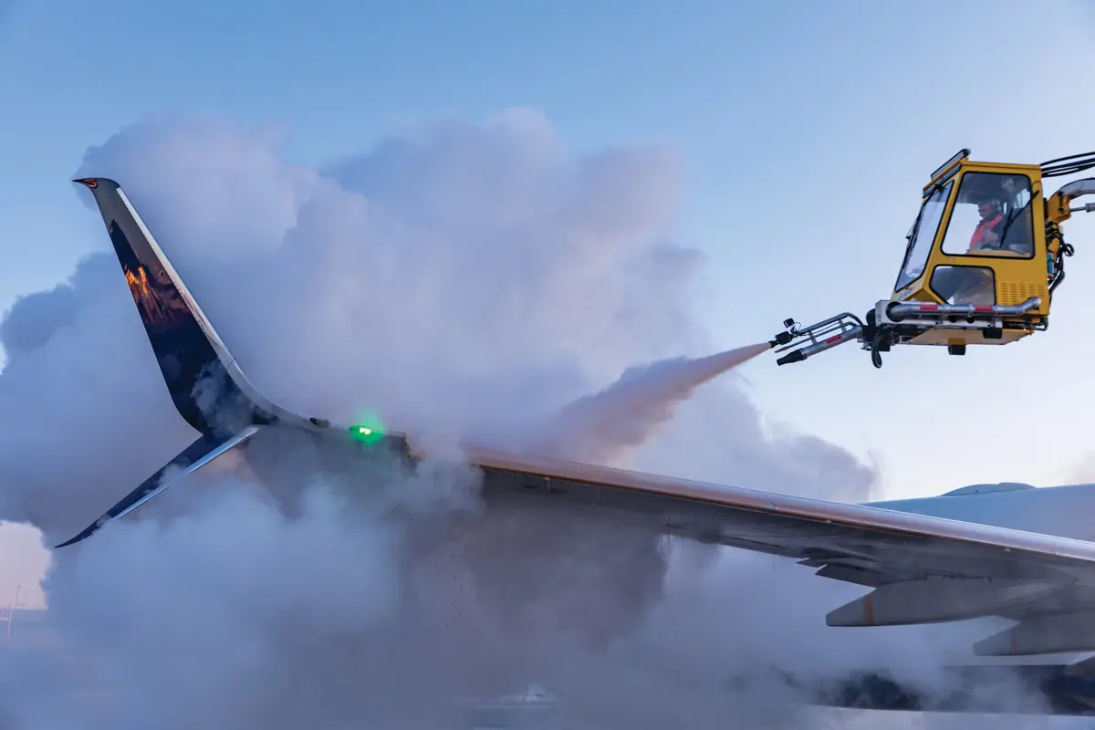Deicing truck spraying down the wing of a Boeing 737-900ER