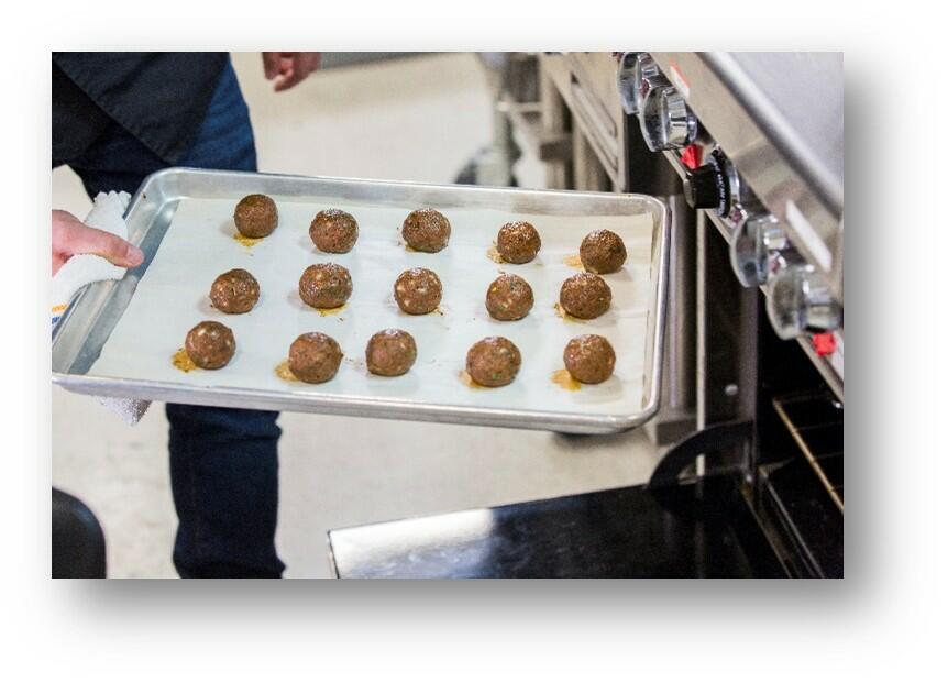 Photograph of Impossible Meatballs — a mix of Impossible Burger and Impossible™ Sausage and seasoned with a savory homestyle blend.