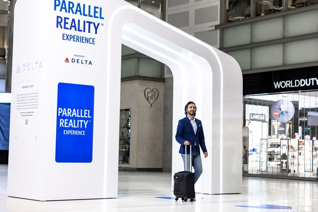 Delta customer entering the new PARALLEL REALITY experience at DTW.