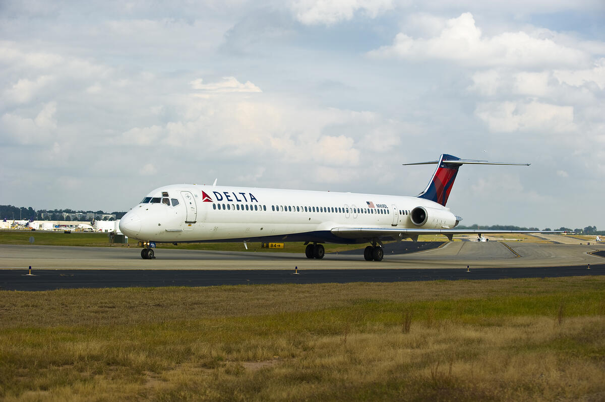 Boeing 717-200 aircraft taxiing on runway