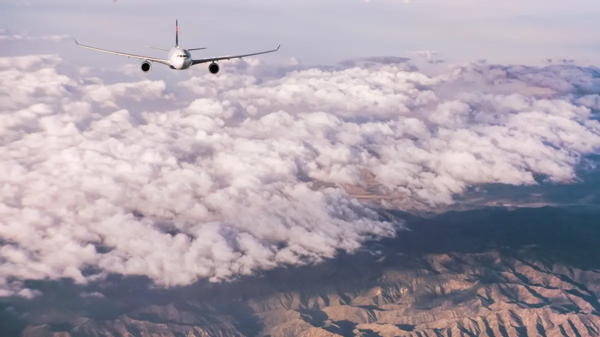 A330-300 flying through clouds