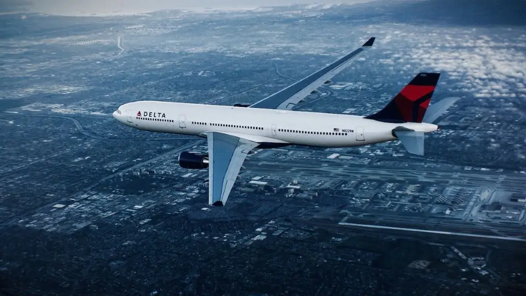 A330-300 in flight over city