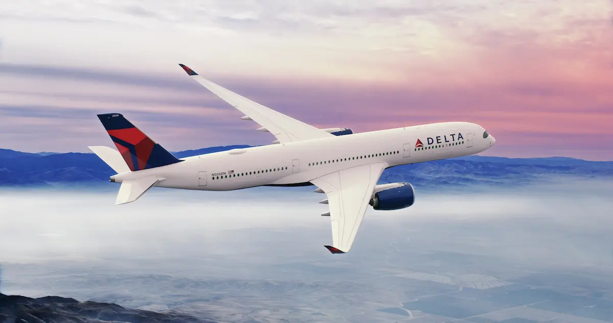 A350-900 in flight with a sunset