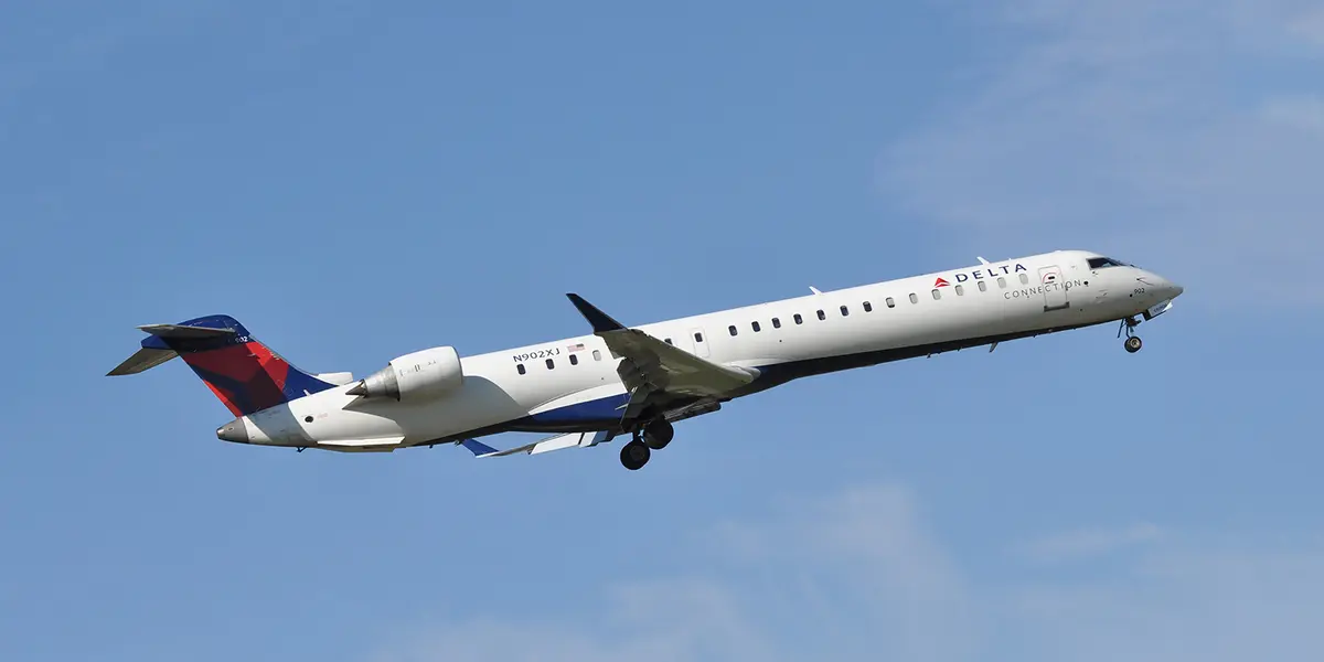 The Bombardier CRJ-900, operated by Delta Connection Carrier Endeavor Air or SkyWest Airlines, takes off.
