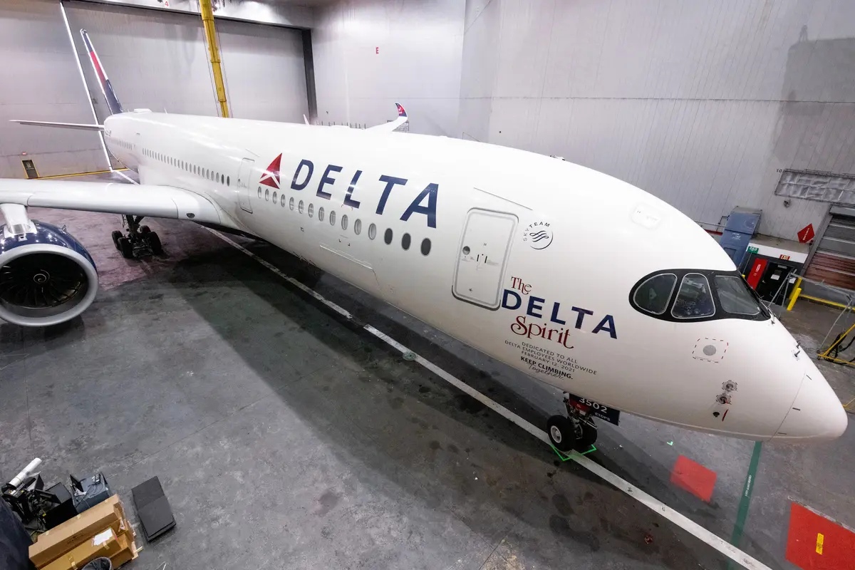 Delta Spirit A350 aircraft chocked inside a maintenance hangar.