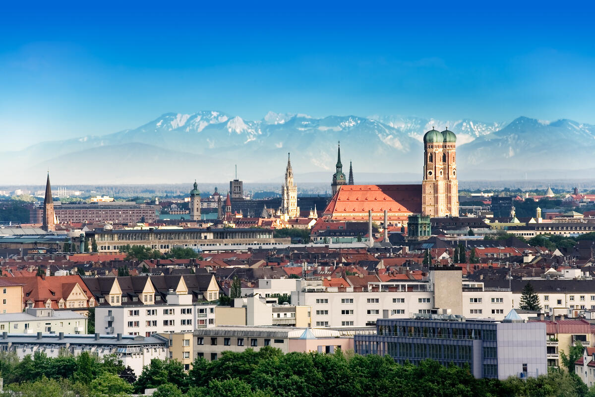 The skyline of Munich, the capital city of Germany's Free State of Bavaria, is seen with the Alps visible in the background.