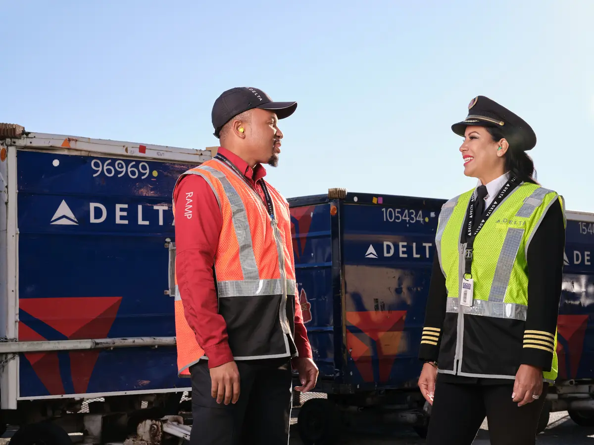 A Delta ramp agent and pilot talk at Hartsfield-Jackson Atlanta International Aiport.