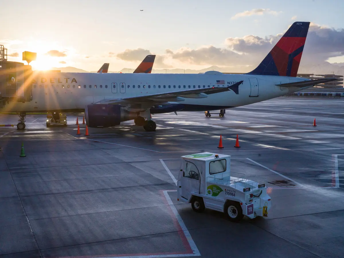 An electric bag tractor with a “zero-emission” vehicle decal is seen on the ramp at Salt Lake City International Airport (SLC).