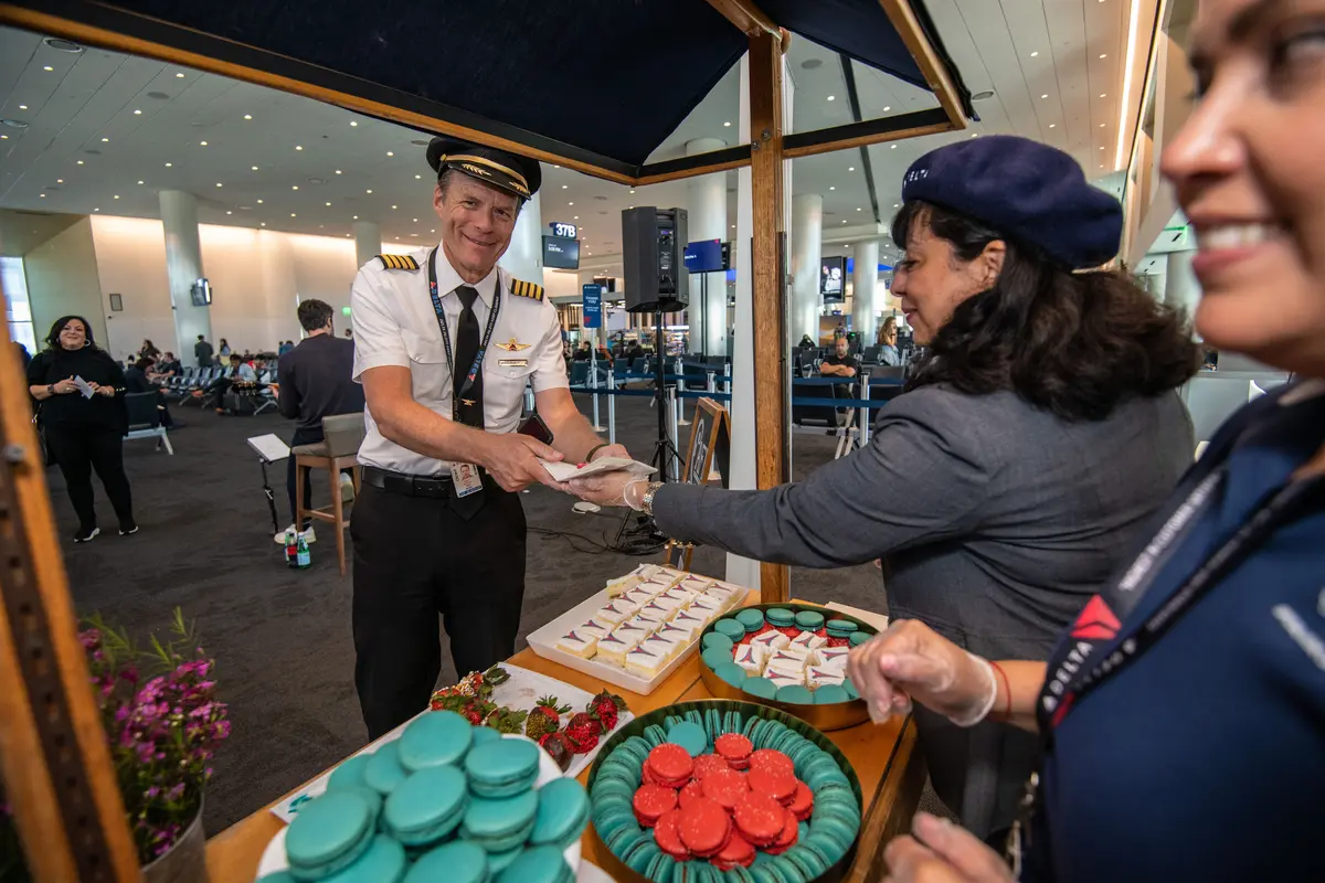 Delta people, customers and friends celebrate the departure of Delta Flight 290 from Los Angeles International Airport (LAX) to Paris Charles de Gaulle Airport (CDG).