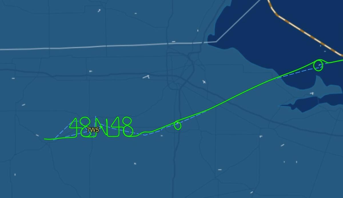 Delta pilots Barry Behnfeldt and Aaron Wilson spell out 48N48 in the sky while flying back home after flying through 48 states in 48 hours.