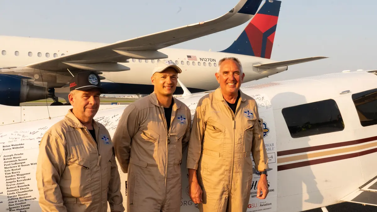 Pilots Barry Behnfeldt and Aaron Wilson, along with maintenance technician Thomas Twiddy make a stop at Hartsfield-Jackson Atlanta International Airport (ATL) during their 48N48 mission -- an attempt to land in all 48 of the contiguous states within 48 hours. They were greeted by Delta Chief of Operations John Laughter.