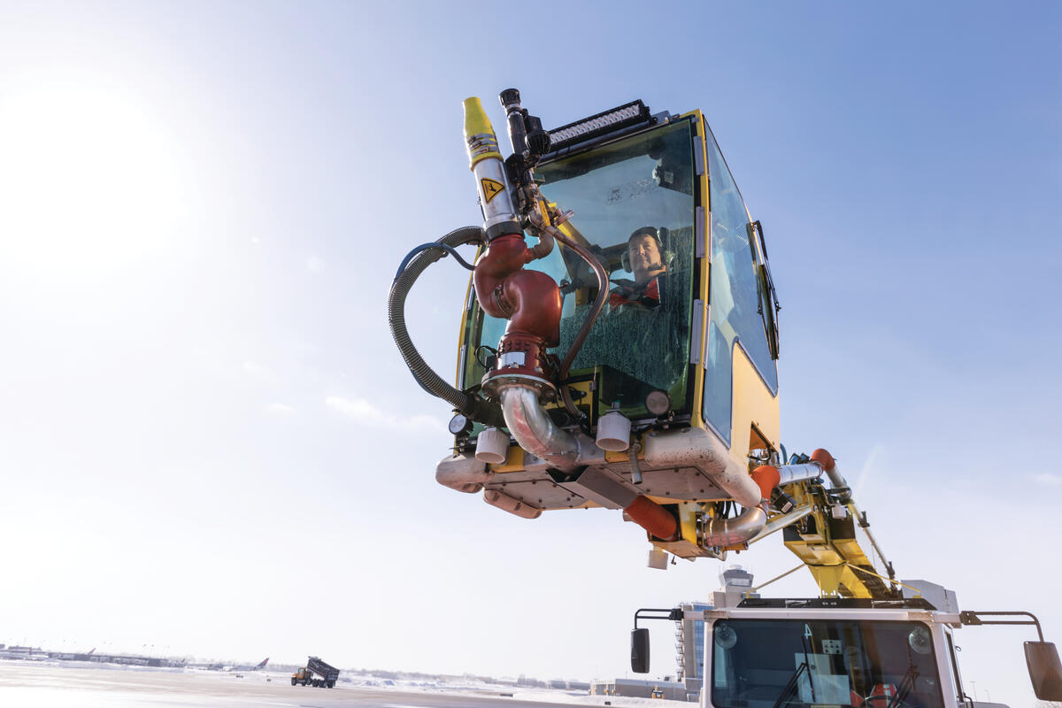 Ramp Agent Bruce Torseth prepares to de-ice aircraft at Minneapolis-St. Paul International Airport.